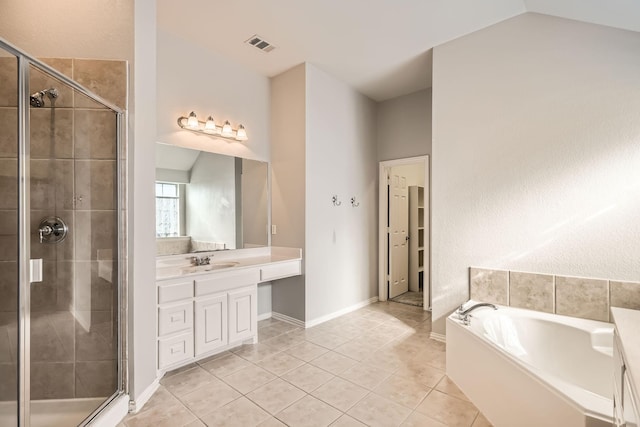 bathroom featuring tile patterned flooring, visible vents, a shower stall, and vanity