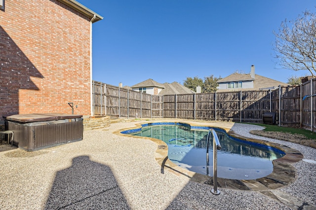 view of pool with cooling unit, a fenced in pool, a fenced backyard, and a hot tub