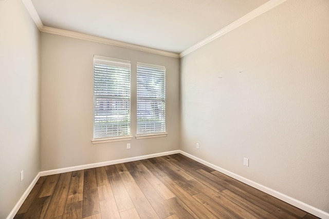 unfurnished room featuring ornamental molding, baseboards, and dark wood-style flooring