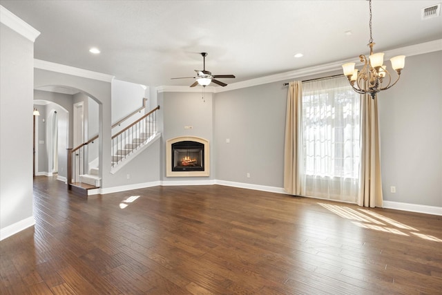 unfurnished living room with baseboards, visible vents, a lit fireplace, stairs, and dark wood-type flooring