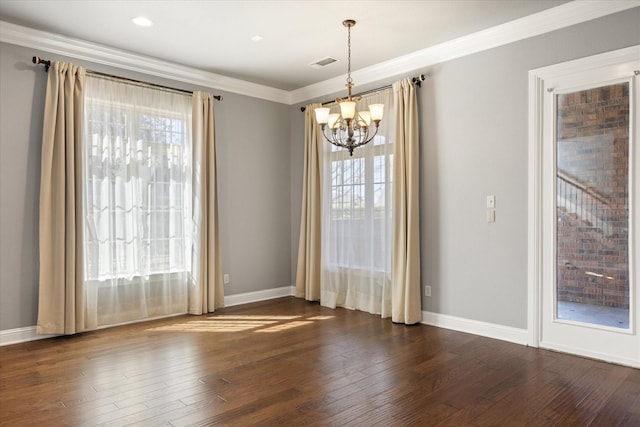 unfurnished room with visible vents, crown molding, baseboards, and dark wood-style flooring