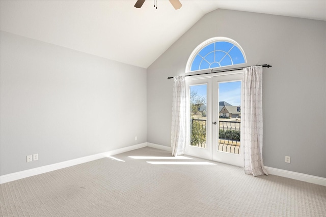 interior space featuring ceiling fan, french doors, high vaulted ceiling, and baseboards