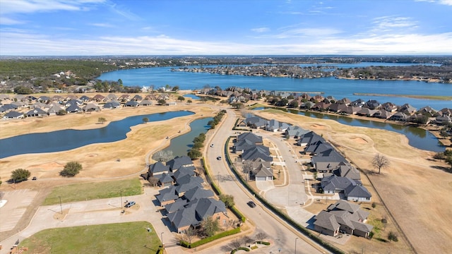 bird's eye view with a residential view and a water view