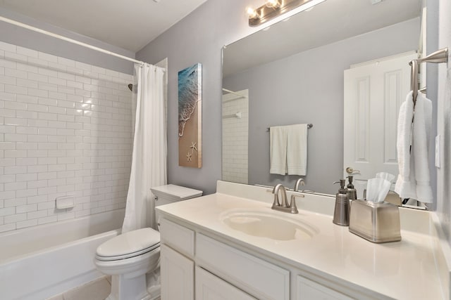 bathroom with tile patterned floors, shower / bath combo with shower curtain, toilet, and vanity