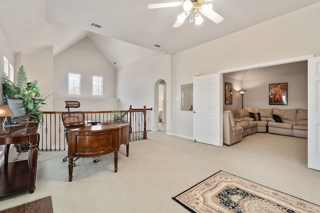 sitting room with visible vents, ceiling fan, carpet floors, an upstairs landing, and arched walkways