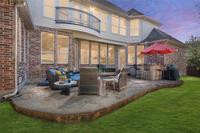 view of patio / terrace with a balcony and area for grilling