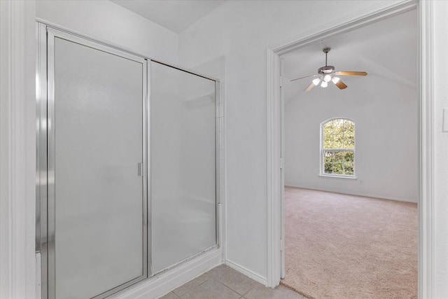 bathroom featuring tile patterned floors, ceiling fan, a stall shower, and lofted ceiling