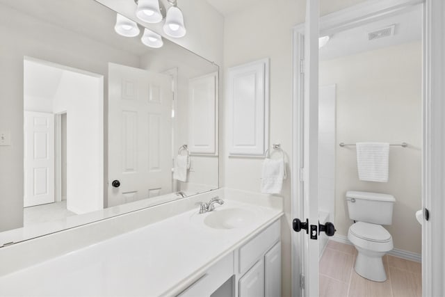 bathroom with tile patterned floors, visible vents, toilet, baseboards, and vanity