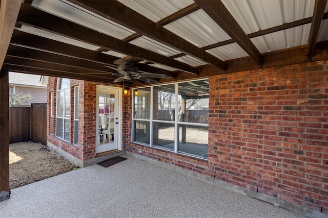 view of patio with fence and ceiling fan