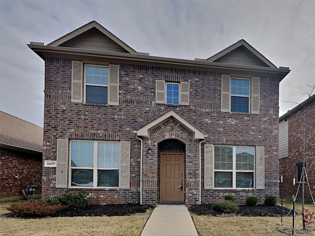 view of front of property with brick siding