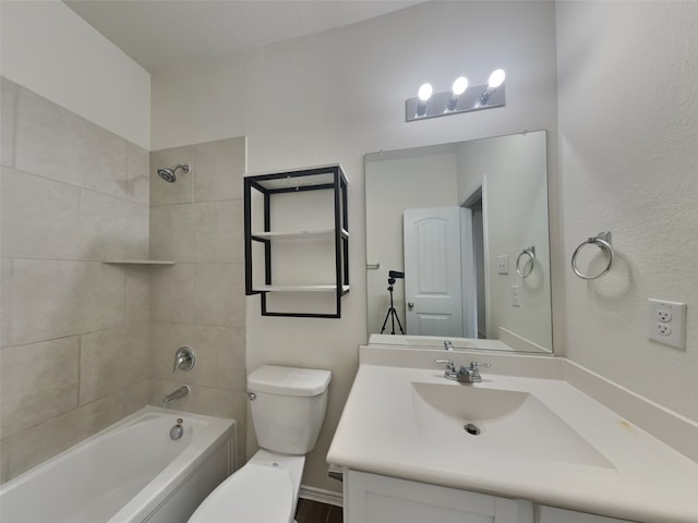 bathroom featuring vanity, toilet, and shower / bathtub combination