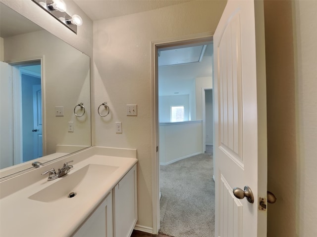 bathroom featuring vanity and baseboards