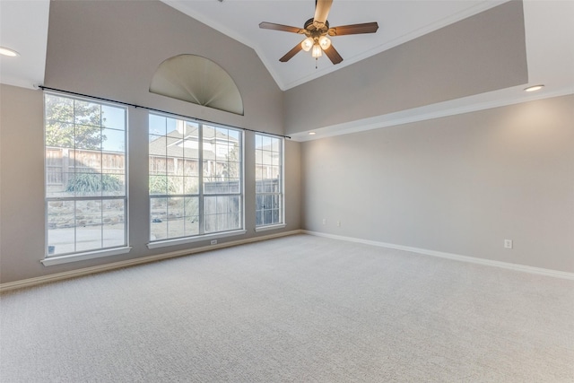 carpeted spare room with a ceiling fan, baseboards, high vaulted ceiling, recessed lighting, and crown molding