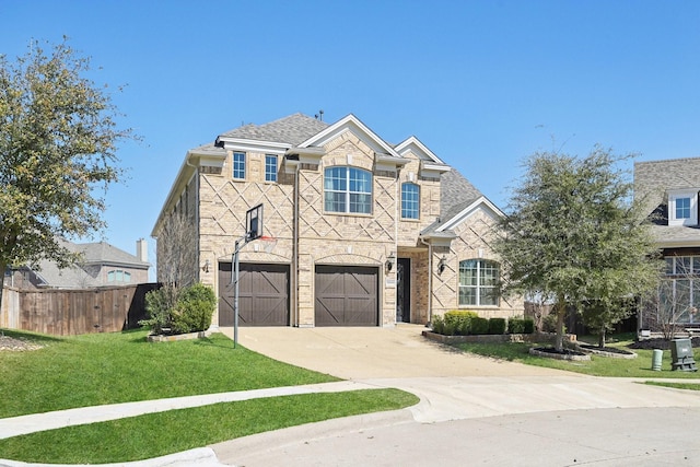 view of front of property with fence, an attached garage, a front lawn, concrete driveway, and brick siding