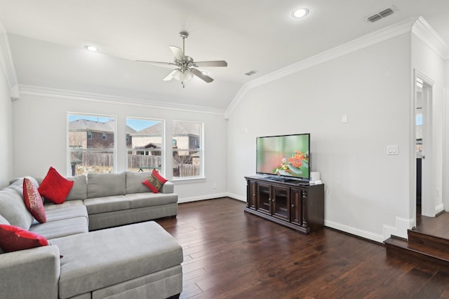 living room featuring baseboards, wood finished floors, visible vents, and ornamental molding