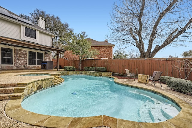 view of pool featuring a ceiling fan, a fenced backyard, a fenced in pool, an in ground hot tub, and a patio area