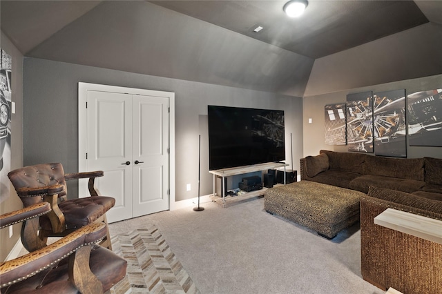 living room featuring vaulted ceiling, carpet flooring, and baseboards