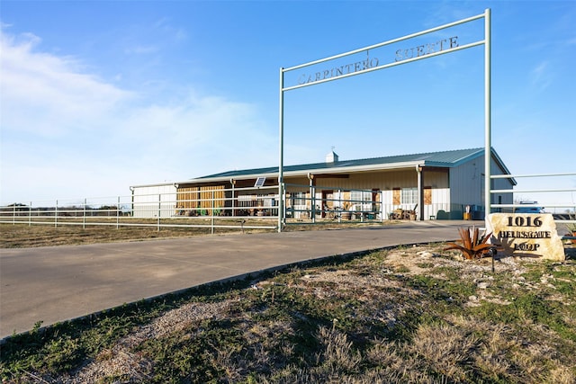 view of building exterior with fence