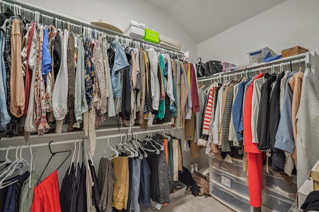 spacious closet featuring lofted ceiling and carpet