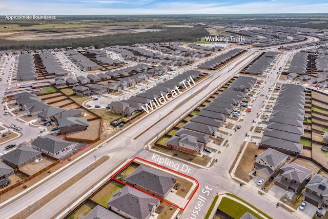 birds eye view of property with a residential view