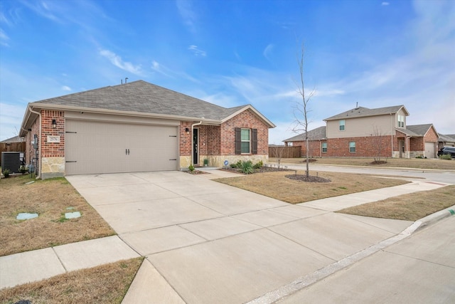 ranch-style house with central air condition unit, a garage, brick siding, and driveway