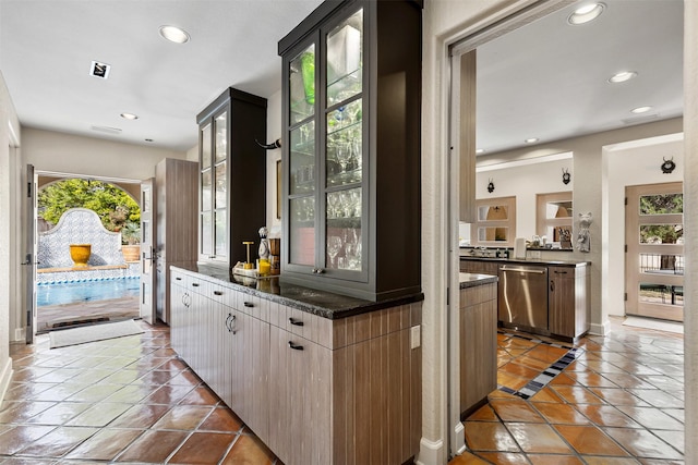 bar featuring light tile patterned floors, recessed lighting, and dishwasher