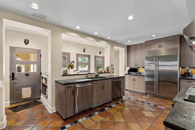 kitchen featuring tile patterned flooring, visible vents, recessed lighting, appliances with stainless steel finishes, and a sink