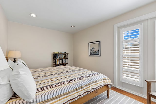 bedroom featuring light wood-style flooring and recessed lighting