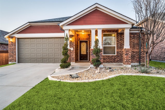 view of front facade featuring a front yard, concrete driveway, brick siding, and an attached garage