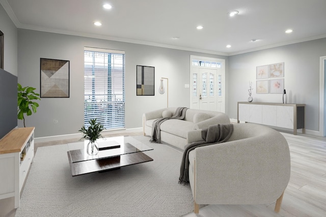 living area with recessed lighting, baseboards, ornamental molding, and light wood finished floors