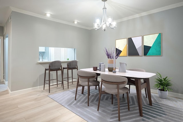 dining room featuring visible vents, baseboards, light wood-style flooring, crown molding, and a chandelier