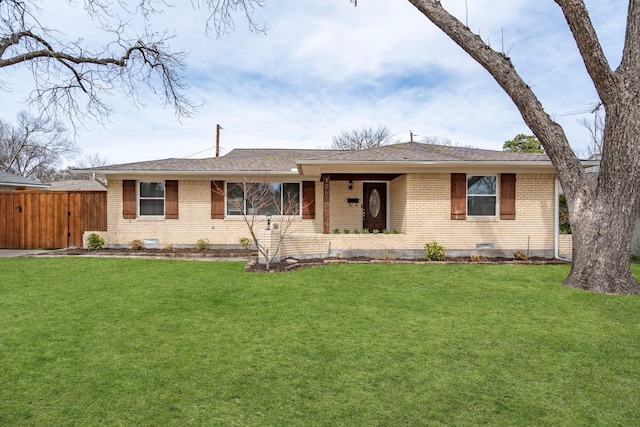 ranch-style house featuring brick siding, crawl space, a front yard, and fence