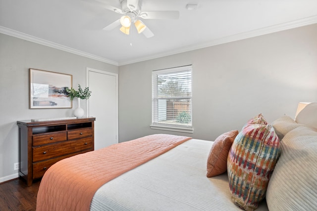 bedroom with baseboards, dark wood-style floors, a ceiling fan, and ornamental molding