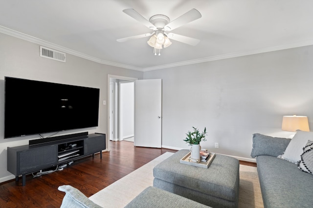 living area with visible vents, wood finished floors, a ceiling fan, and ornamental molding