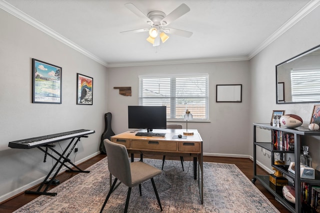 office space featuring dark wood finished floors, ceiling fan, crown molding, and baseboards