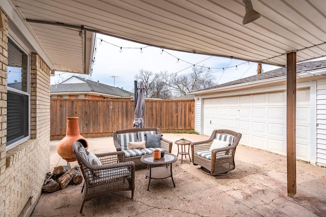 view of patio / terrace featuring outdoor lounge area and fence