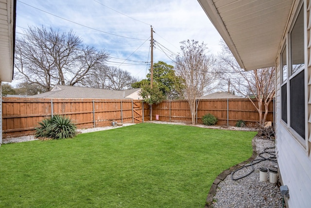 view of yard featuring a fenced backyard