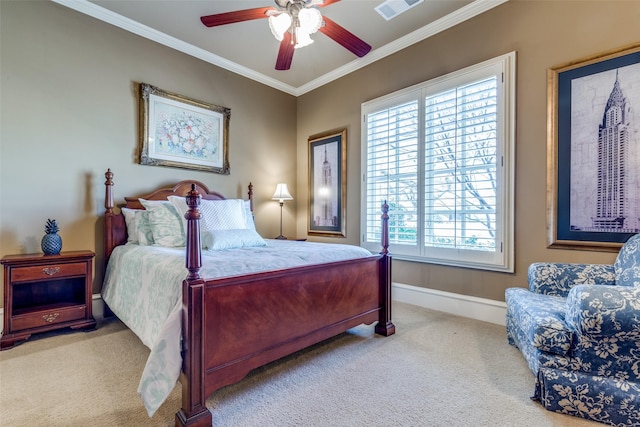 carpeted bedroom featuring crown molding, baseboards, visible vents, and ceiling fan