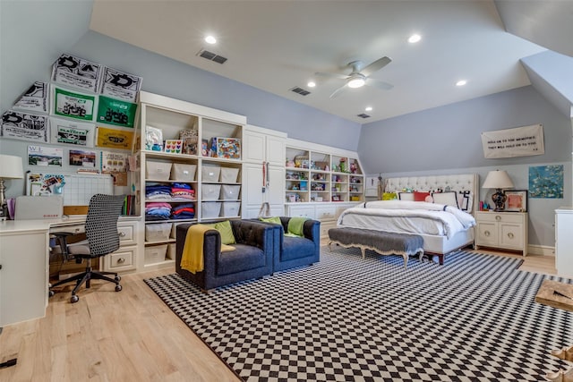 bedroom featuring visible vents, light wood-style floors, a ceiling fan, and vaulted ceiling