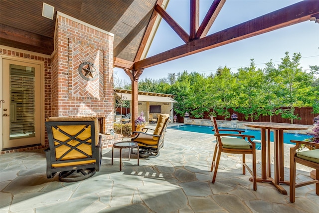 view of patio with fence and a fenced in pool