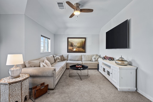 living area featuring visible vents, light carpet, lofted ceiling, baseboards, and ceiling fan