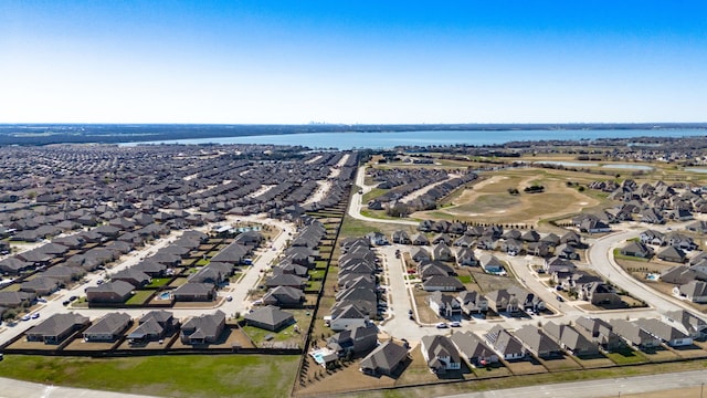 drone / aerial view with a residential view and a water view