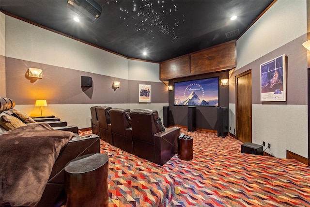 cinema room with visible vents and carpet floors