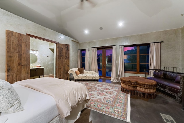 bedroom featuring visible vents, finished concrete floors, connected bathroom, french doors, and vaulted ceiling