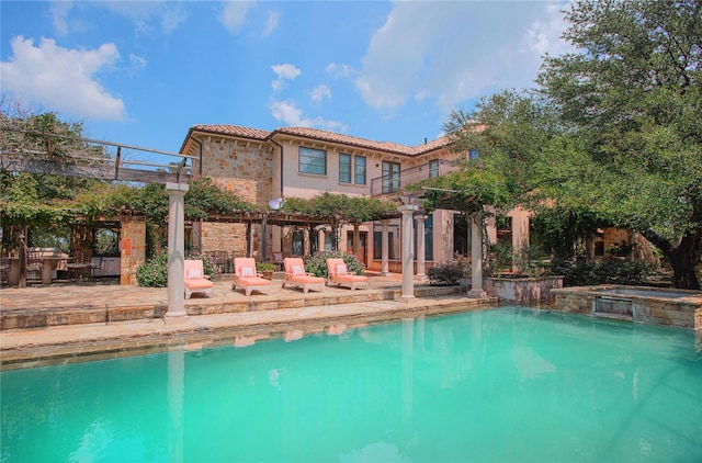 view of swimming pool with a patio area, a pergola, and a pool with connected hot tub