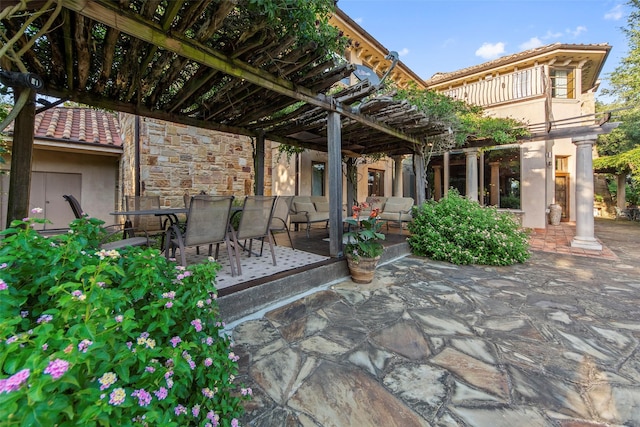 view of patio / terrace with outdoor dining space and a pergola