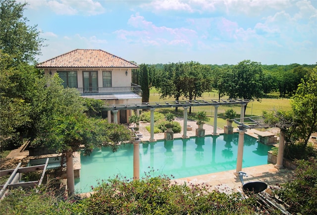 outdoor pool featuring a patio