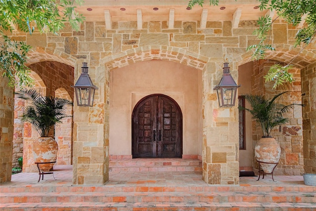 view of exterior entry with stone siding