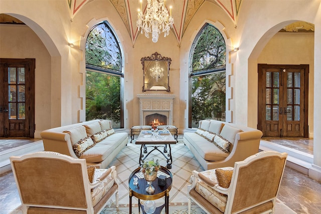 interior space featuring arched walkways, a high ceiling, and a warm lit fireplace