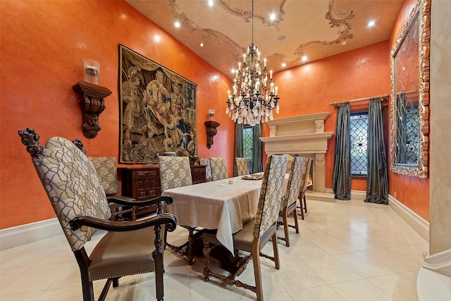 tiled dining room with a notable chandelier, recessed lighting, and baseboards